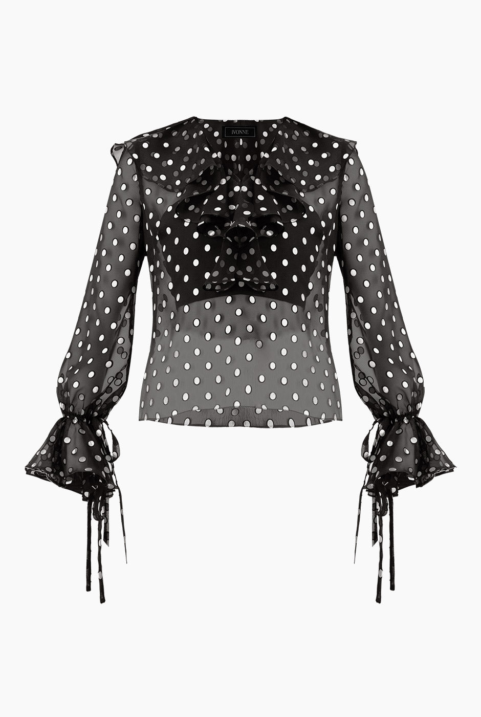 Blusa negra de lunares con escote en V y volantes
