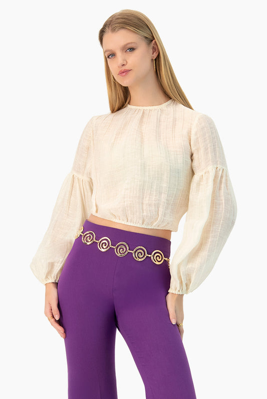 Blusa marfil de manga larga tipo globo, cuello redondo